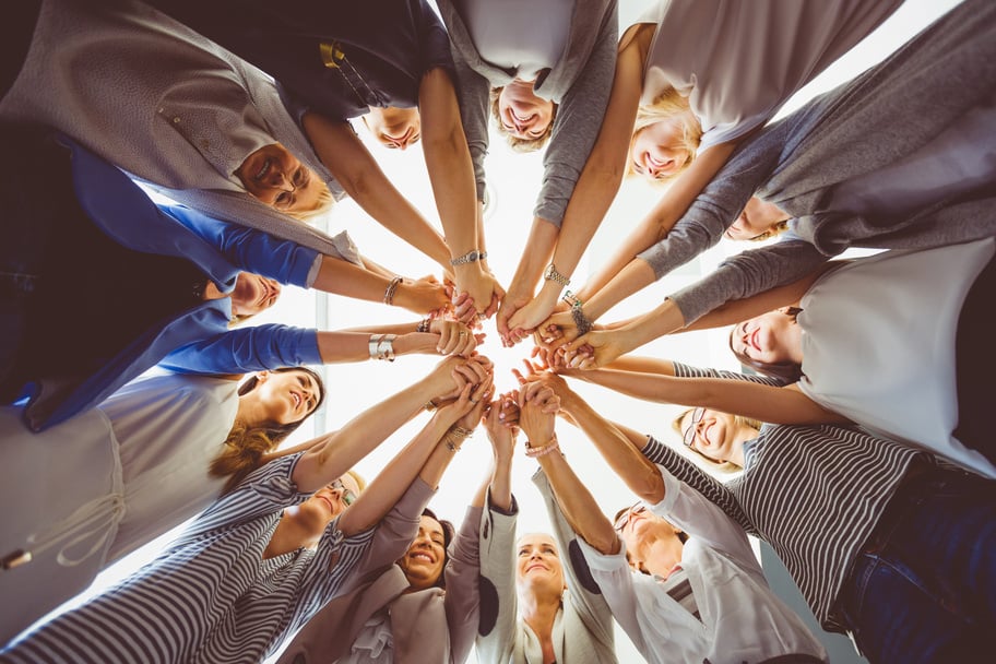 Women’s team. Group of women holding hands