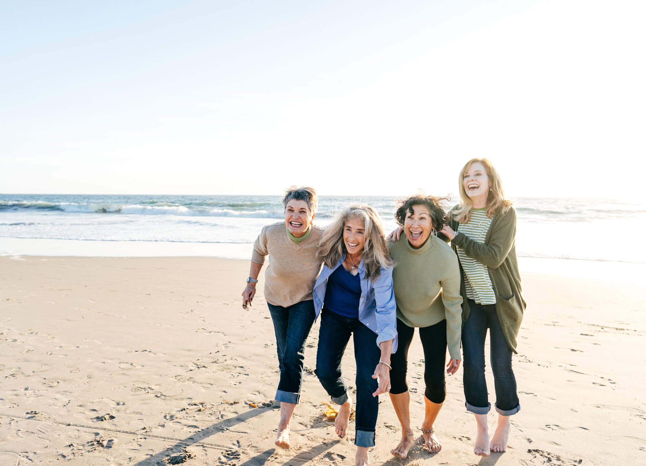 Happy senior women group on the beach